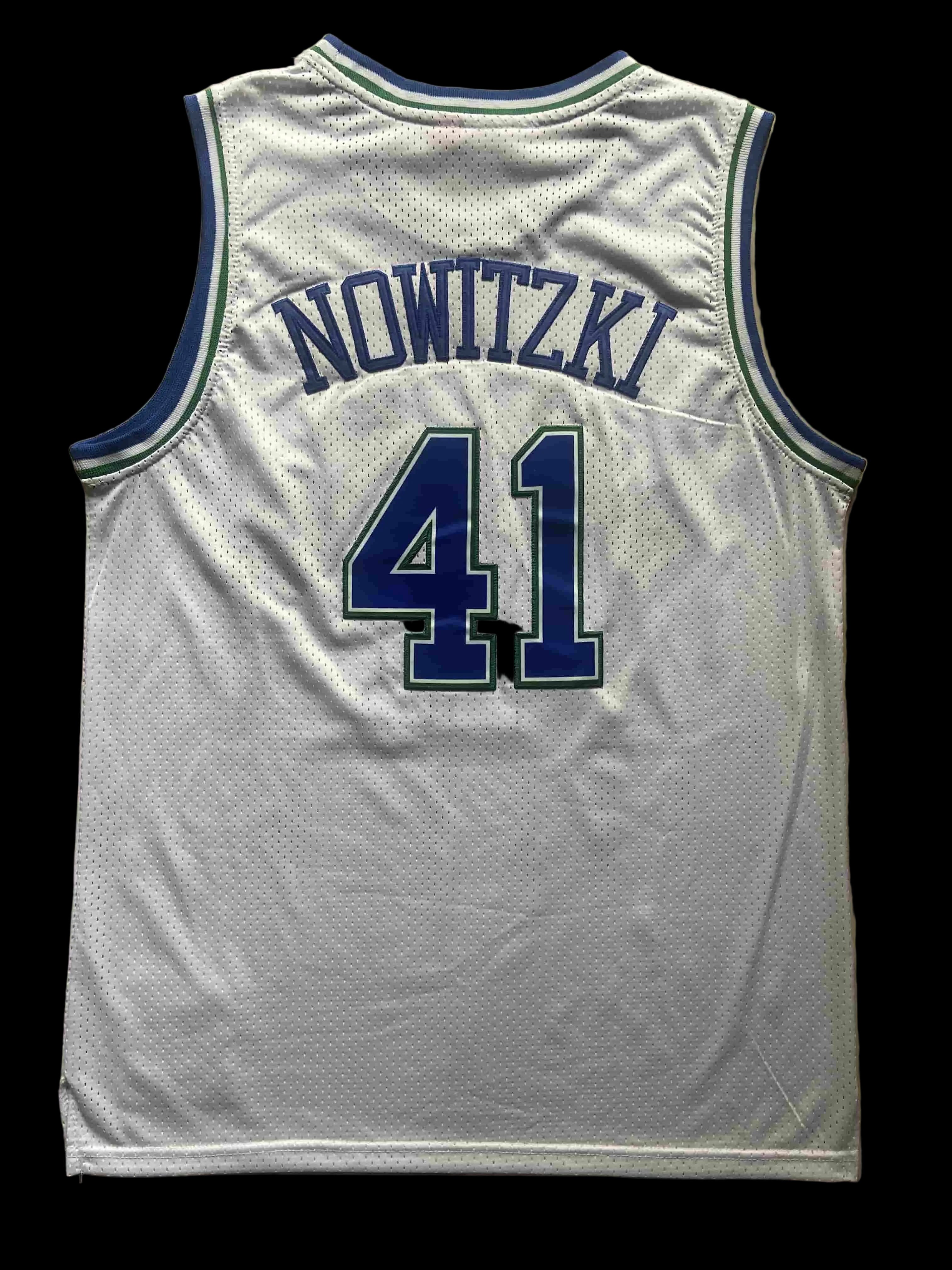 White basketball jersey with 'NOWITZKI' and number '41' on a beige background