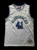 White basketball jersey with 'Mavericks' and number '41' on a beige background